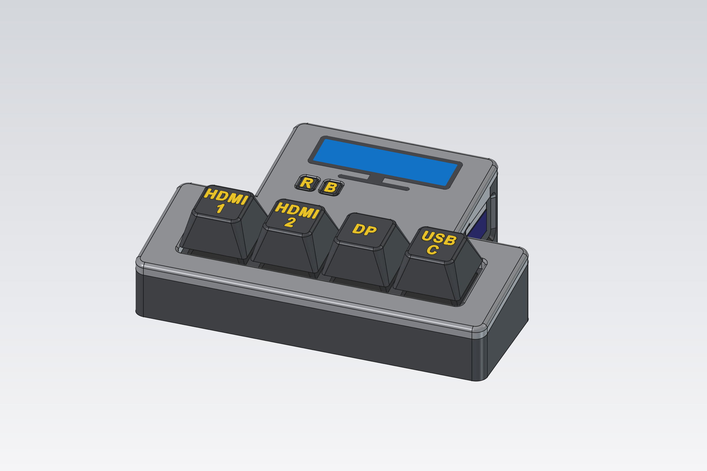 The switch: a gray tilted case with four black keys labelled HDMI 1, HDMI 2, DP and USB C, an inlaid ultrawide monitor and two small R and B buttons
